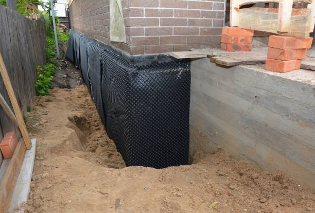 SJ Waterproofing Pros technician performing targeted Exterior Waterproofing assessment in Riverdale, MI